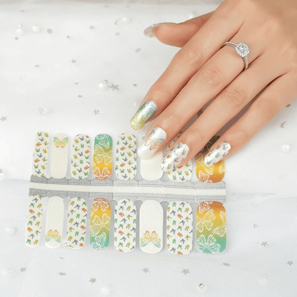 Holy Classics nail wraps in white and orange-green ombre with butterfly and bird outline motifs
