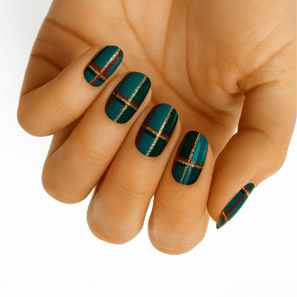Teal tartan nail wraps with gold metallic stripes on hand showcasing Scottish plaid design