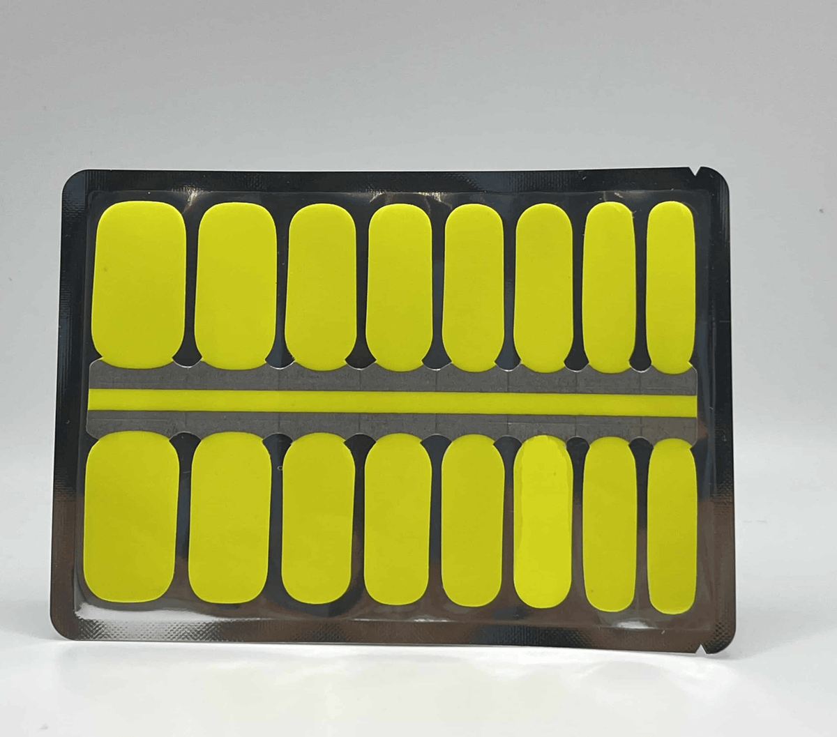 Canary yellow nail wraps packaging sheet showing bright neon manicure strips