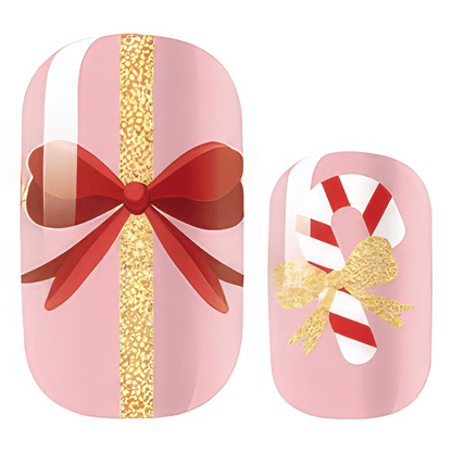 Pink nail wraps featuring gold glitter, red ribbons and candy cane patterns