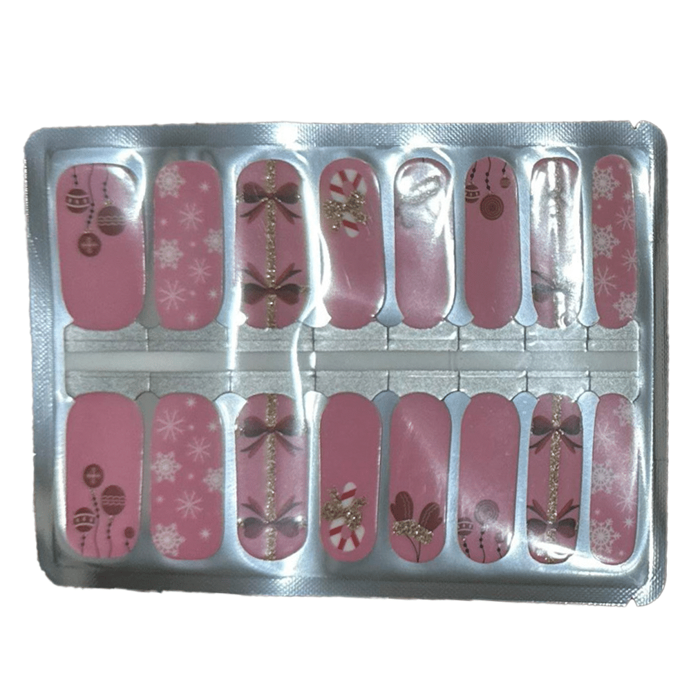 Pink Christmas nail wraps sheet with candy cane and bow designs for festive manicure