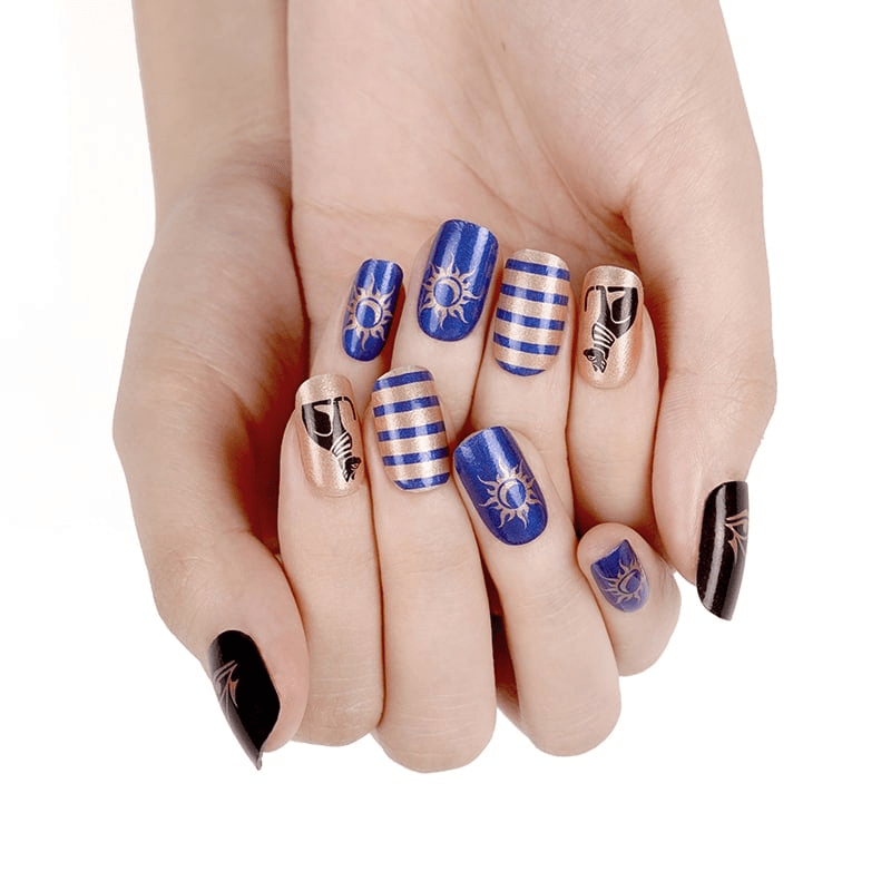 Hand wearing Egyptian cat nail art wraps blue stripes hieroglyphic symbols manicure
