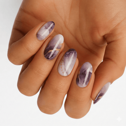 Purple and grey marble nail wraps with gold foil streaks, glossy finish, oval shape