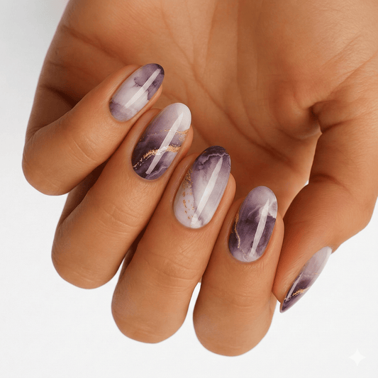 Purple and grey marble nail wraps with gold foil streaks, glossy finish, oval shape