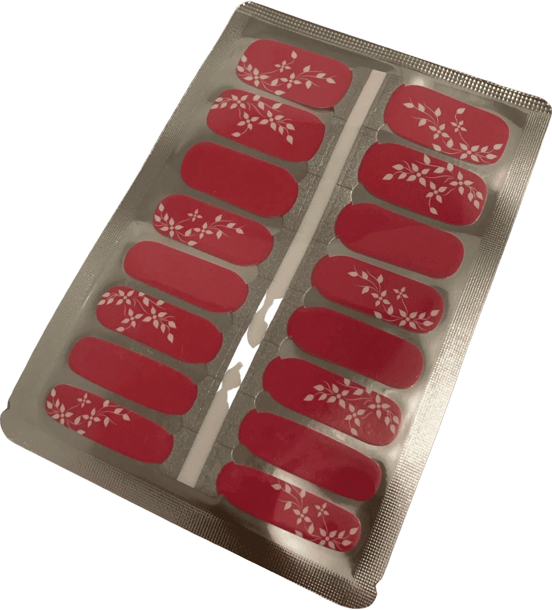 Cerise red nail wraps with ivory floral vine accents, glossy finish, on foil backing sheet