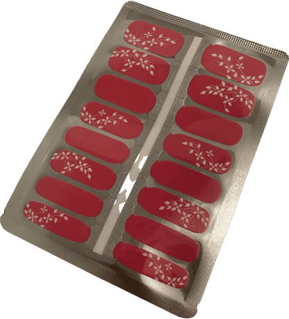 Cerise red nail wraps with ivory floral vine accents, glossy finish, on foil backing sheet