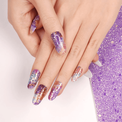 Holy Classics nail wraps in purple, teal and copper galaxy-print with glitter flecks
