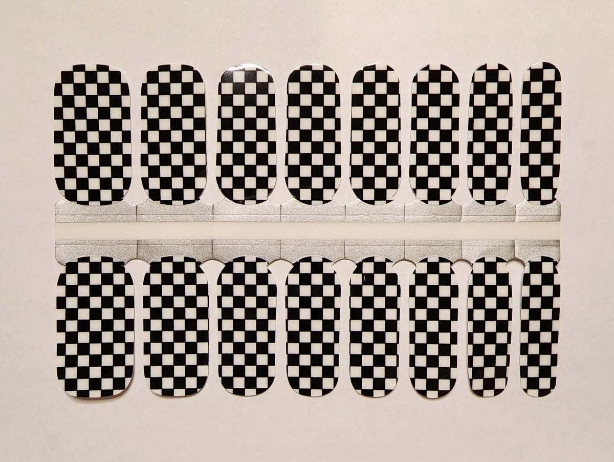 Black and white checkered nail wraps in classic checkerboard pattern for at-home manicure