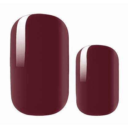 Deep burgundy nail wraps with a glossy white vertical stripe accent, glossy finish
