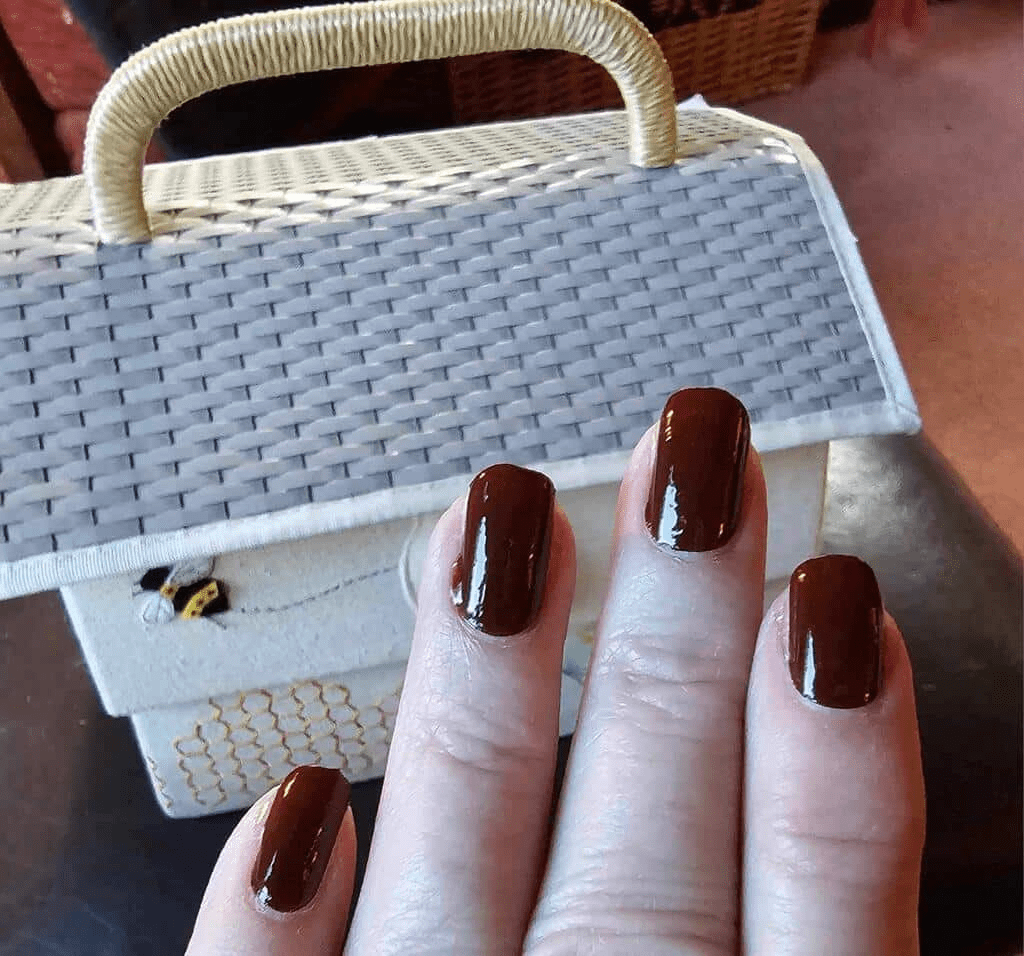 Glossy deep brown Holy Classics non-UV nail wraps on short round nails