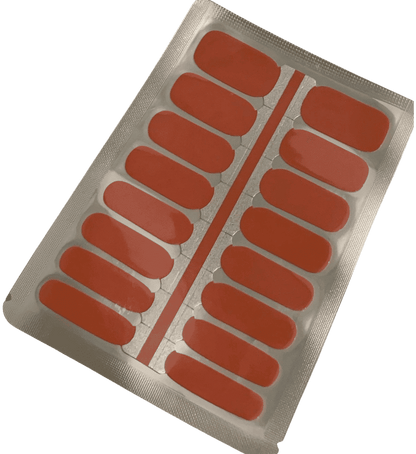 Coral orange nail wraps sheet showing individual strips for at-home manicure