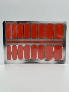 Coral orange non-UV nail wraps set in black packaging for at-home manicure