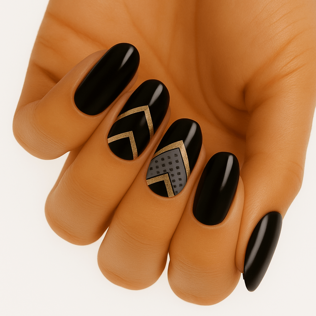 Glossy black nail wraps with gold chevron outline and grey textured accent nail