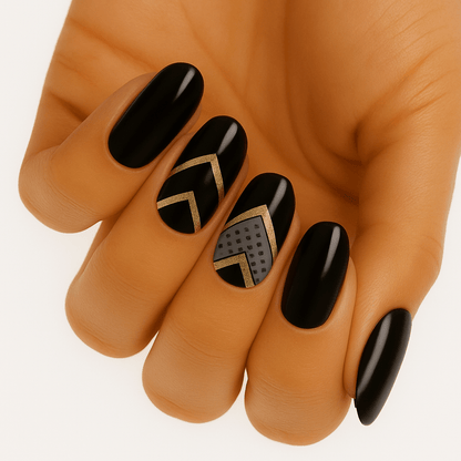 Glossy black nail wraps with gold chevron outline and grey textured accent nail