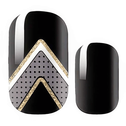 Glossy black nail wraps featuring gold chevron patterns with dotted geometric accents