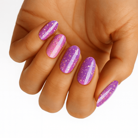 Pink and purple glittery nail wraps with holographic sparkles on hand manicure