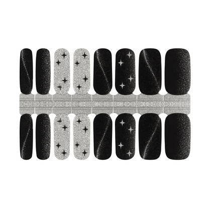 Black and silver glitter nail wraps with star patterns and lightning bolt designs