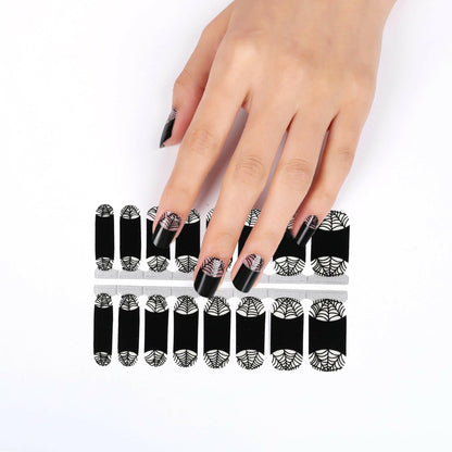 Gothic spider web nail wraps sheet showing black and white Halloween nail art designs