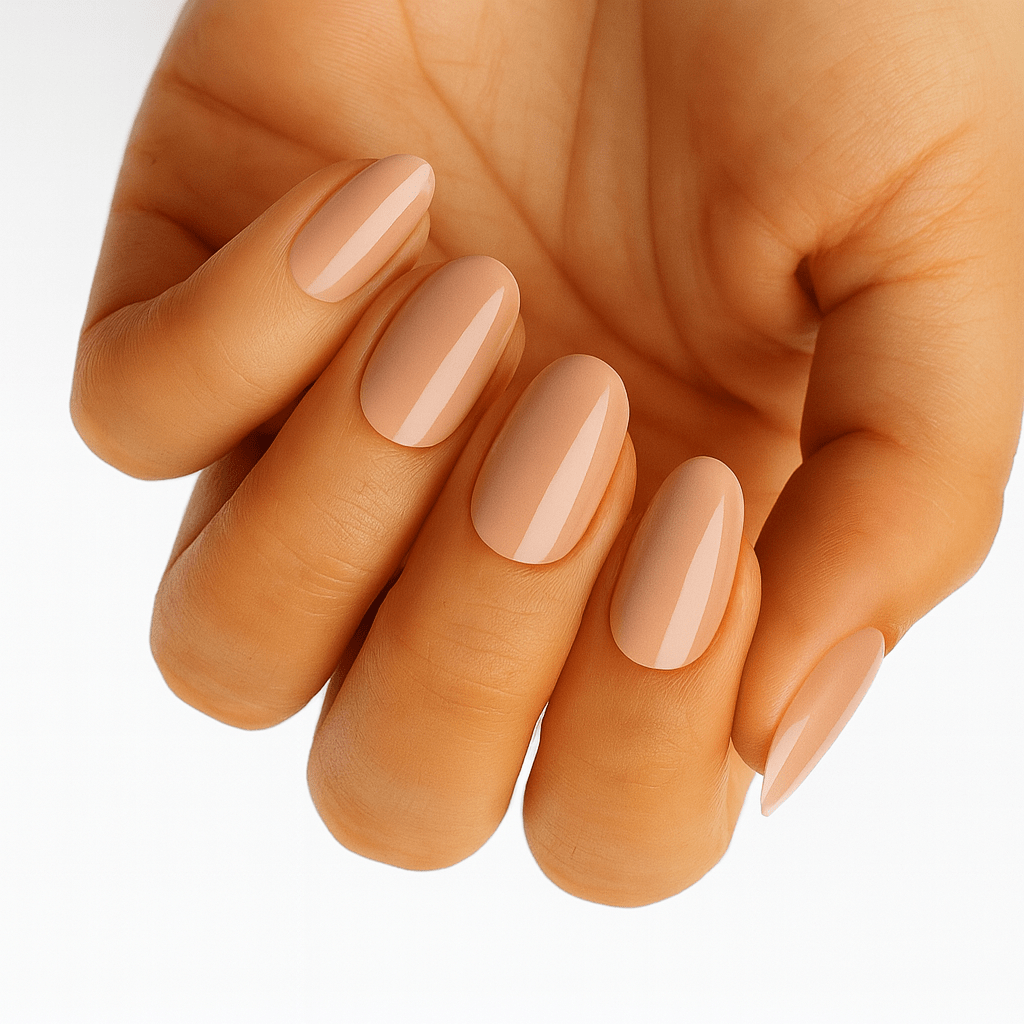 Glossy caramel brown nude nail wraps on hand showing natural oval manicure finish