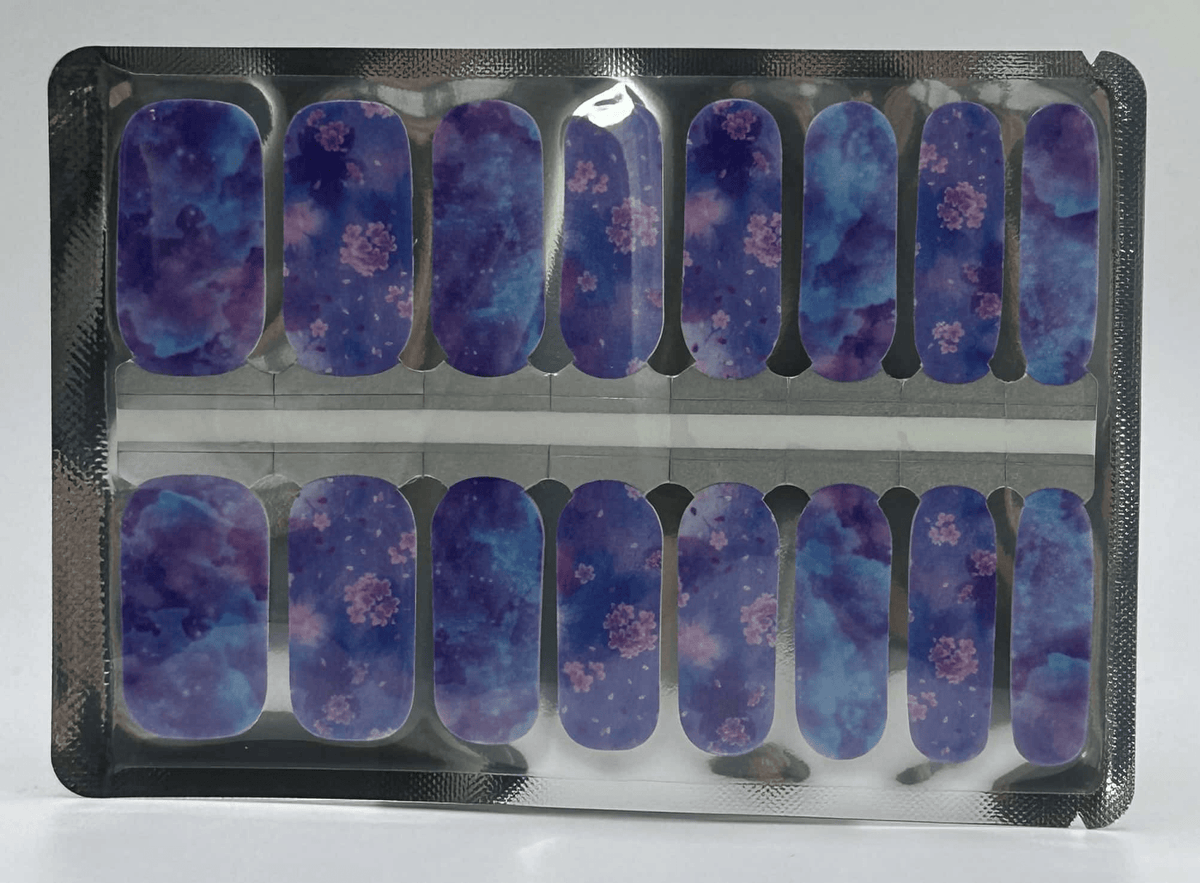 Holy Classics nail wraps, purple-blue tie-dye with pink floral clusters, glossy finish