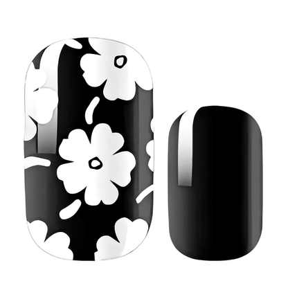 Non-UV nail wraps featuring black base with white daisy flowers and solid black design