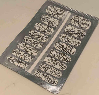 Non-UV nail wraps sheet featuring white base with black geometric line pattern design