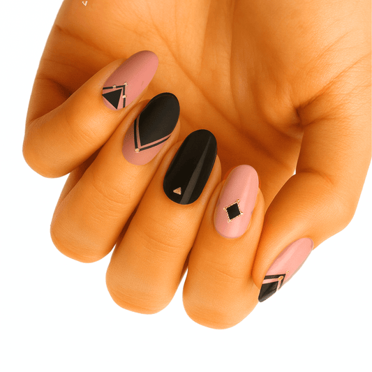 Matte mauve and glossy black nail wraps with gold-outlined geometric shapes