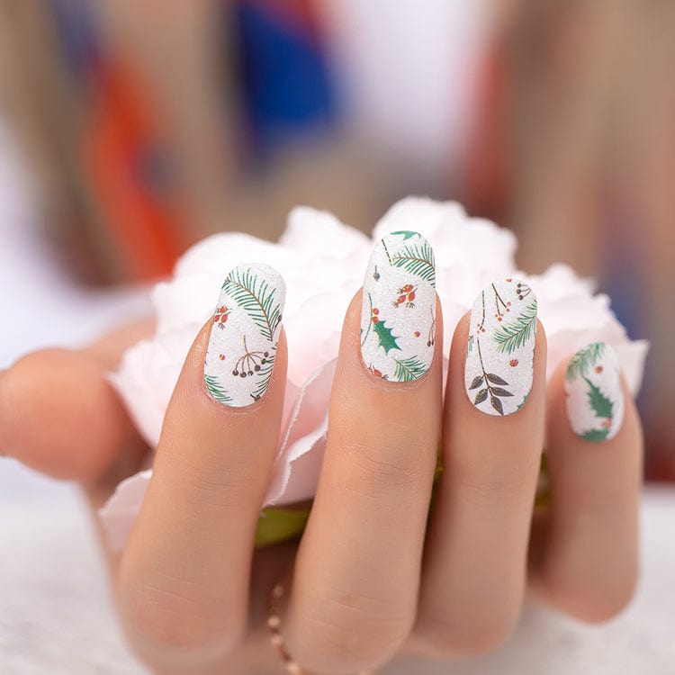 White glitter nail wraps with green pine, holly and red berry festive print design