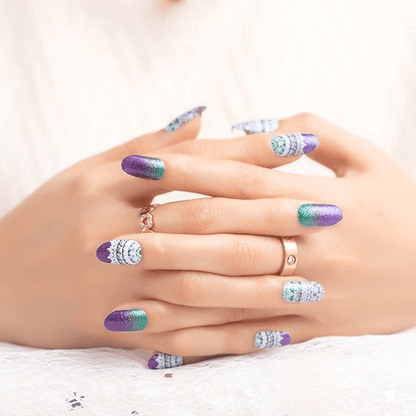 Purple-to-teal shimmer nail wraps with white lace-pattern accent tips