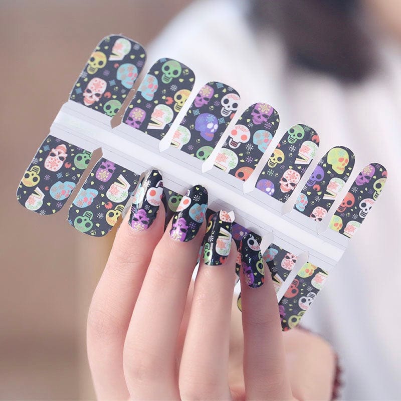 Black nail wraps with colourful sugar skull, Day of the Dead floral design