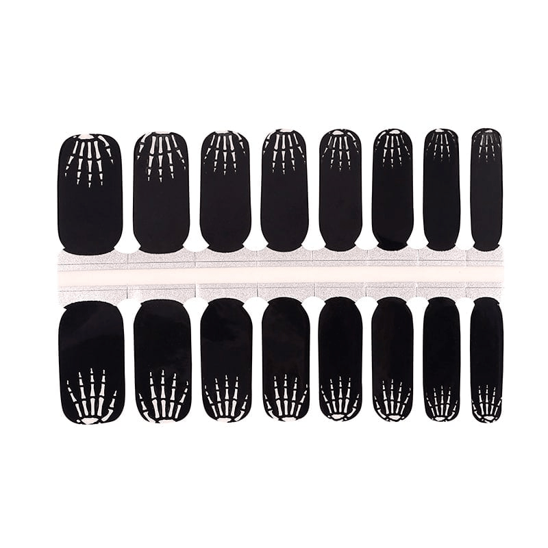 Complete set of black skeleton bone pattern nail wraps for spooky Halloween manicure