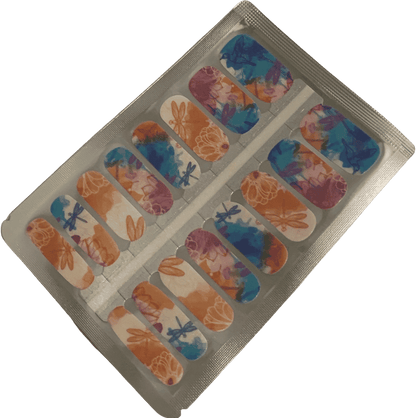 Blue and orange watercolour dragonfly nail wraps with botanical garden design in packaging