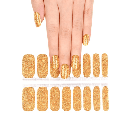 Gold glitter nail wraps sheet with hand model showing complete set for at-home manicure