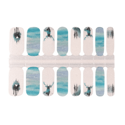 Blue and grey watercolour nail wraps featuring woodland stag and tree silhouettes