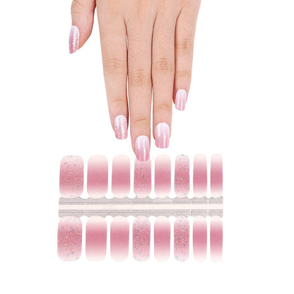 Pink ombré nail wraps with glitter accents, fading to sheer, glossy tips