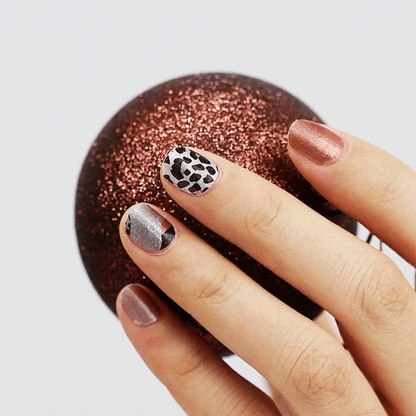 Rose gold shimmer nail wraps with silver and black leopard print accent nails