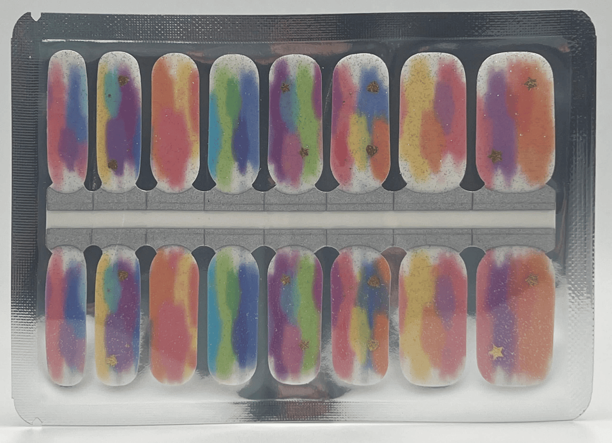 Sheet of holographic gradient nail wraps in rainbow colours with gold shimmer effects