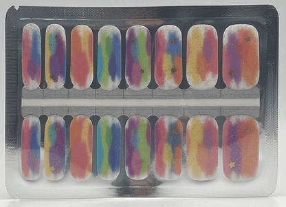 Sheet of holographic gradient nail wraps in rainbow colours with gold shimmer effects