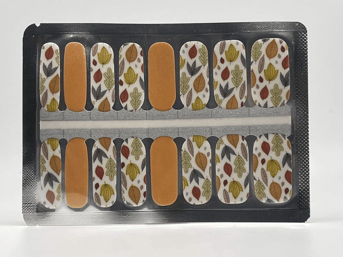 Non-UV nail wraps sheet featuring autumn leaves pattern in orange and yellow tones