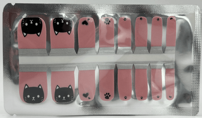 Pink and black cat themed pedicure nail wraps with kawaii feline faces and paw prints