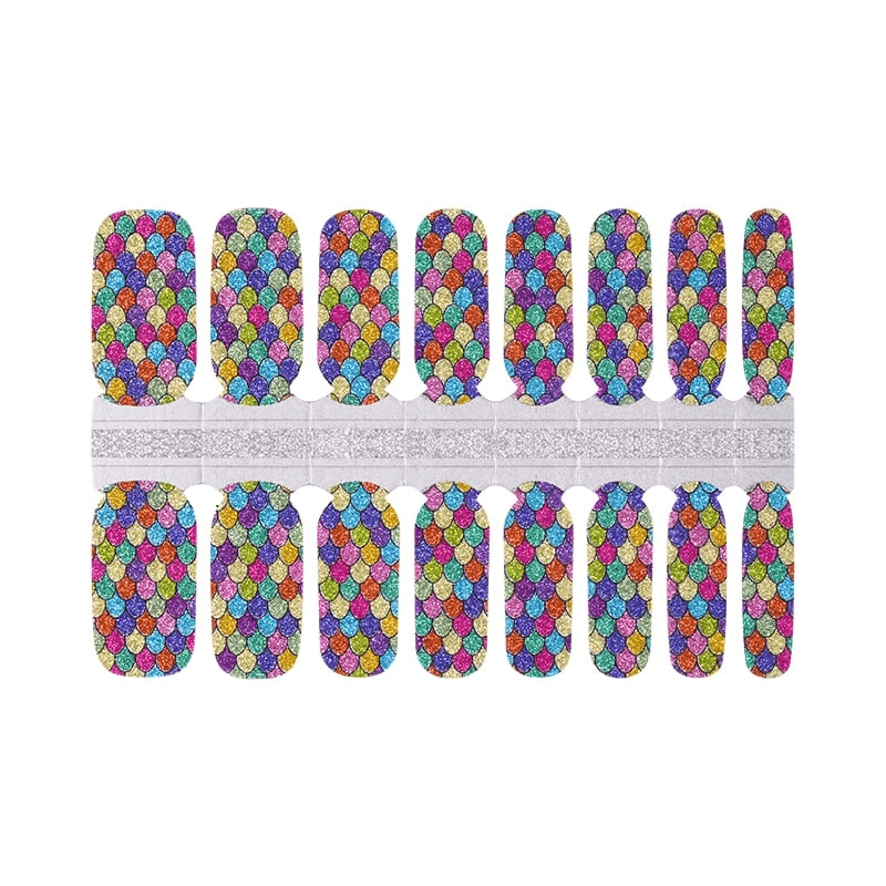 Complete sheet of rainbow holographic nail wraps featuring vibrant mermaid scale pattern