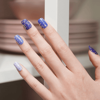 Royal blue glitter nail wraps with metallic sparkles on hand manicure design