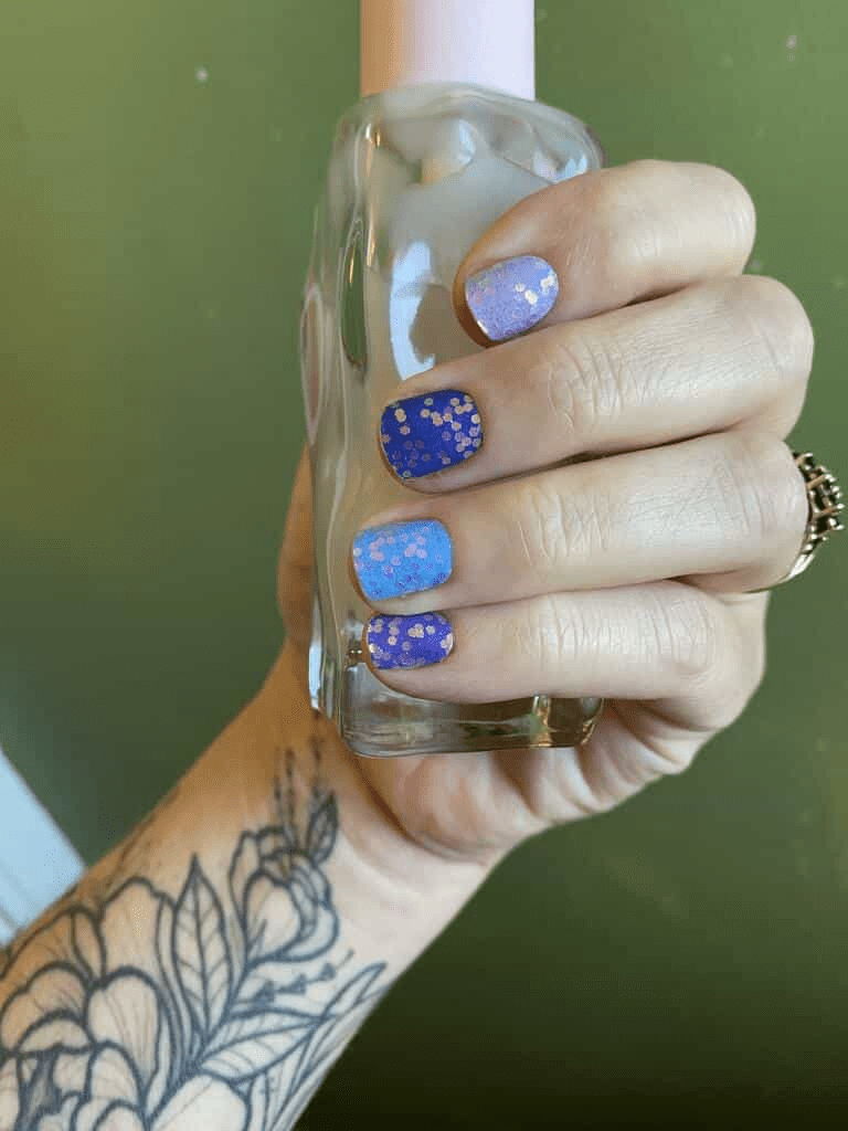 Holy Classics nail wraps in shades of blue and purple with gold glitter speckles