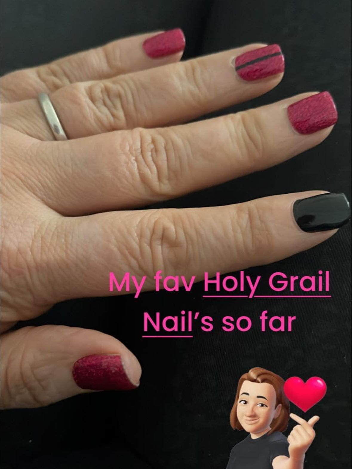 Hand wearing burgundy and black accent nail wraps for at-home manicure nail art