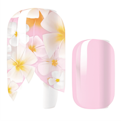 White nail wraps with pink plumeria flowers and matching solid pink design
