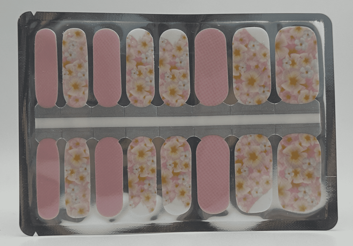 Pink floral nail wraps sheet showing white daisy pattern for at-home manicure
