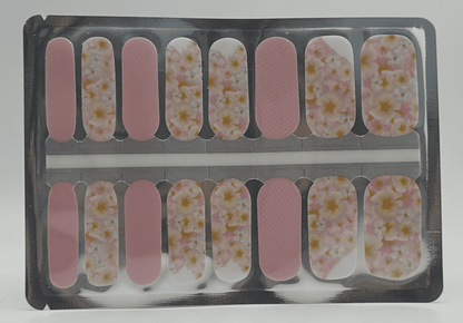 Pink floral nail wraps sheet showing white daisy pattern for at-home manicure