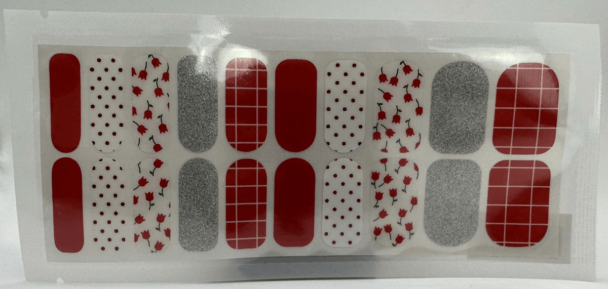 Wide fit nail wrap sheet with red, silver glitter and floral patterns for at-home manicure