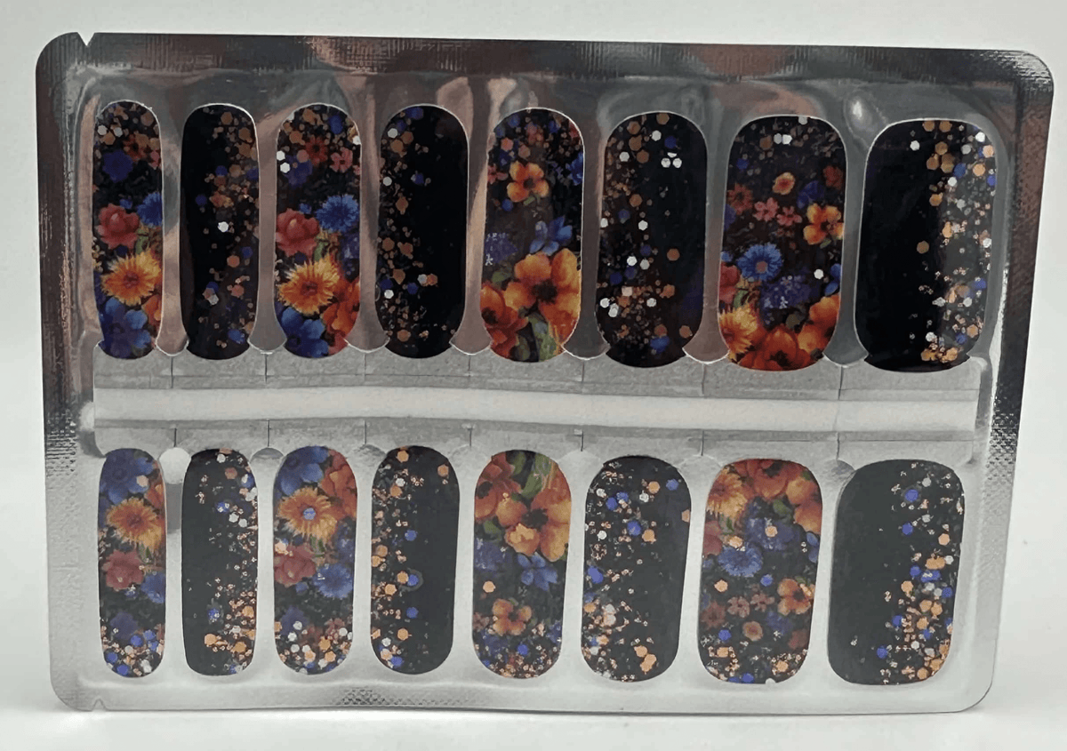 Black nail wraps with autumn floral pattern and gold glitter dots