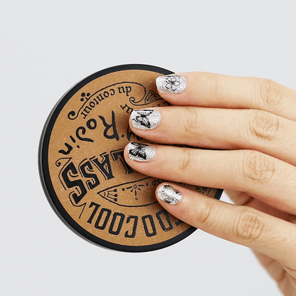 Silver glitter nail wraps with black butterfly outline design on fingers